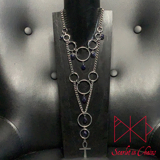 Stainless Steel Eternal Midnight Necklace - Statement Necklace - Blue Goldstone - O ring collar showing on stand, goth choker, alternative collar, stainless steel jewellery, goth jewellery, event jewellery. Goth Necklace, Stainless Steel Necklace, Event Necklace