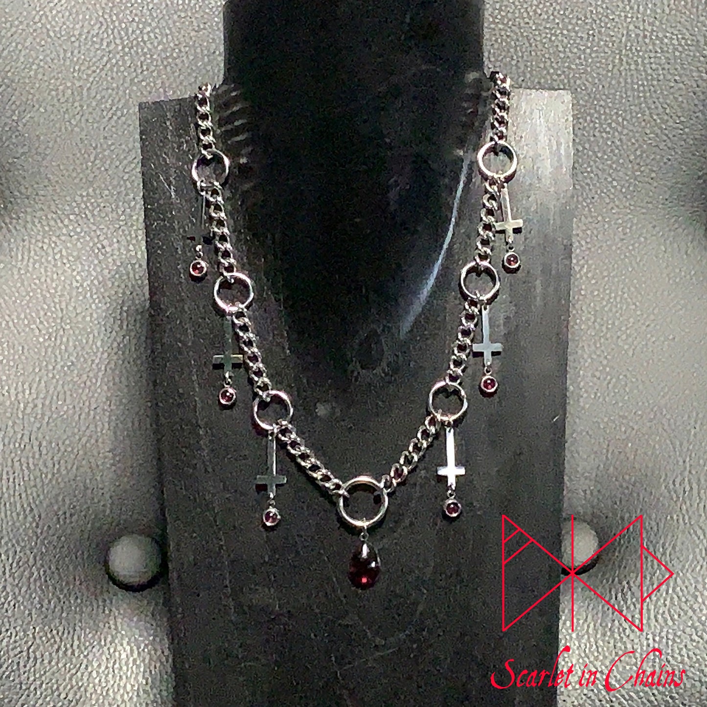 Stainless Steel Unholy Lover Necklace - Statement Necklace - Vampire Necklace - Garnet - O ring collar showing on stand
