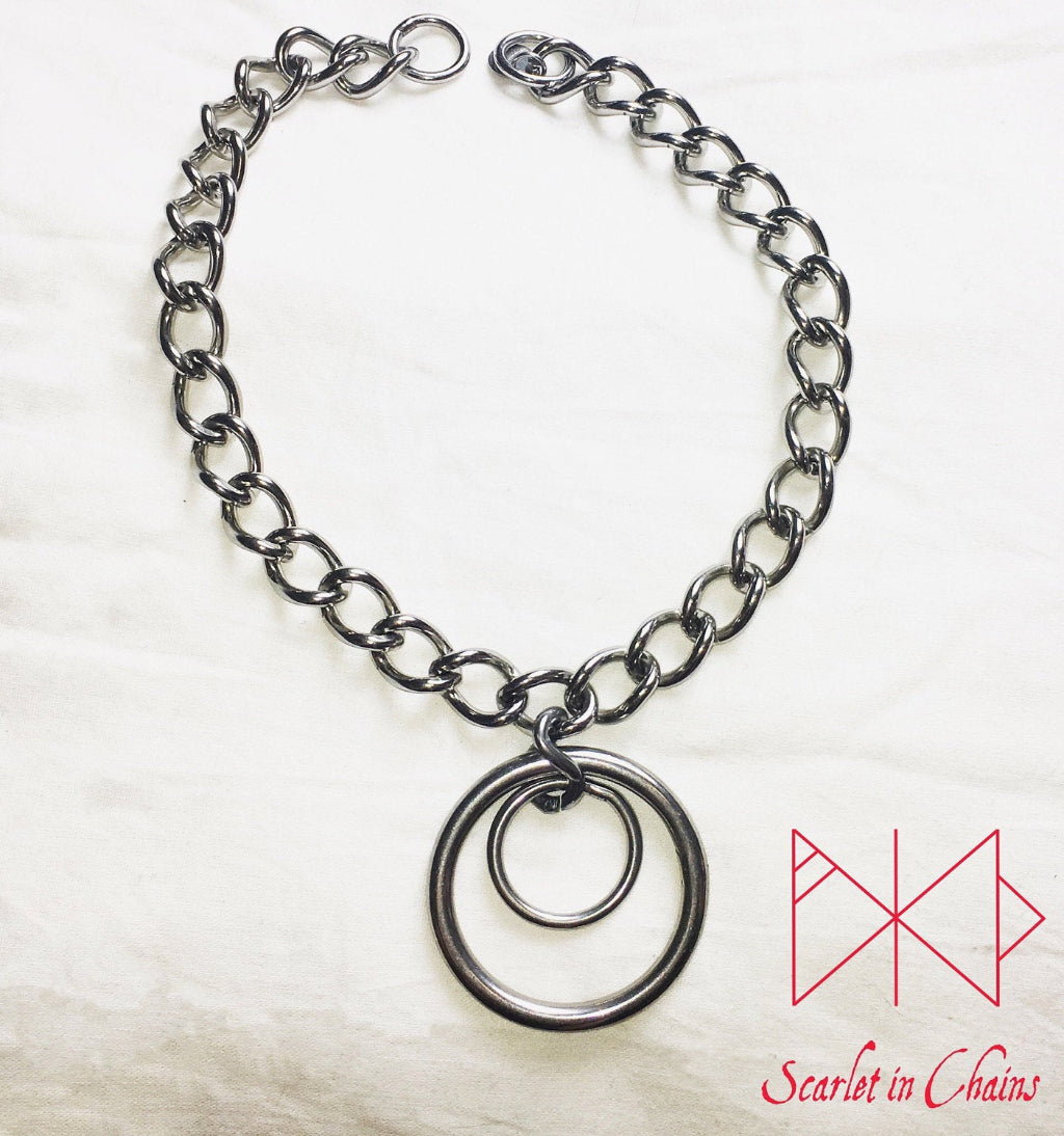 flat shot Eclipse Collar, 3mm chain collar with large 40mm O ring with a 20mm smaller O ring inside it, goth choker, alternative collar, stainless steel jewellery, goth jewellery, event jewellery. Goth Necklace, Stainless Steel Necklace, Event Necklace