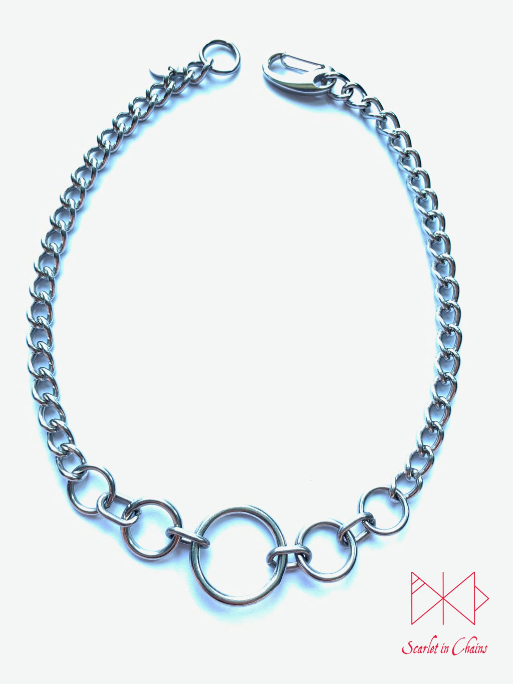 Stainless steel Luna Phase chain choker with multiple o rings in reducing sizes indicating a moon phase pattern. Shown flat with new links, goth choker, alternative collar, stainless steel jewellery, goth jewellery, event jewellery. Goth Necklace, Stainless Steel Necklace, Event Necklace, witch jewellery, witch necklace, witchy necklace, witchy jewellery, day collar