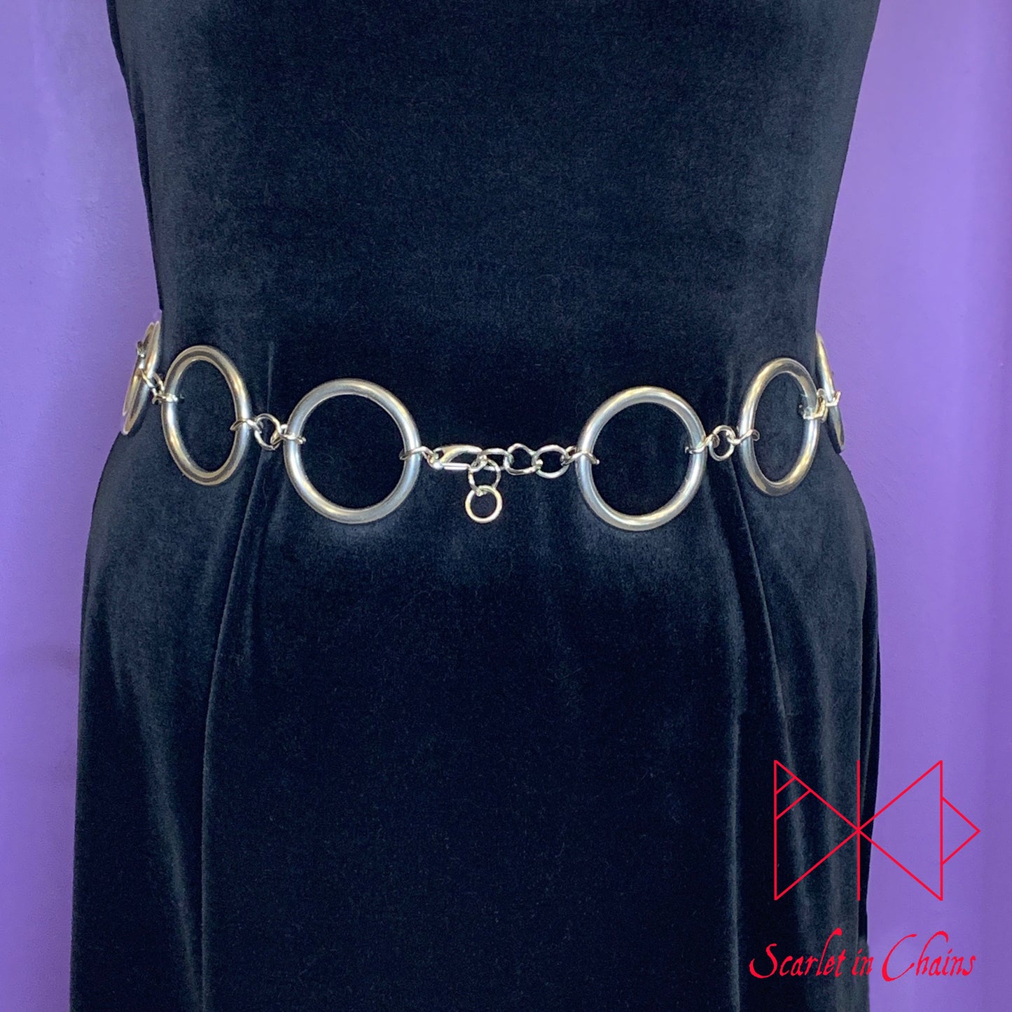 worn shot of Solar belt, large stainless steel O rings joined with large stainless steel chain links shown front