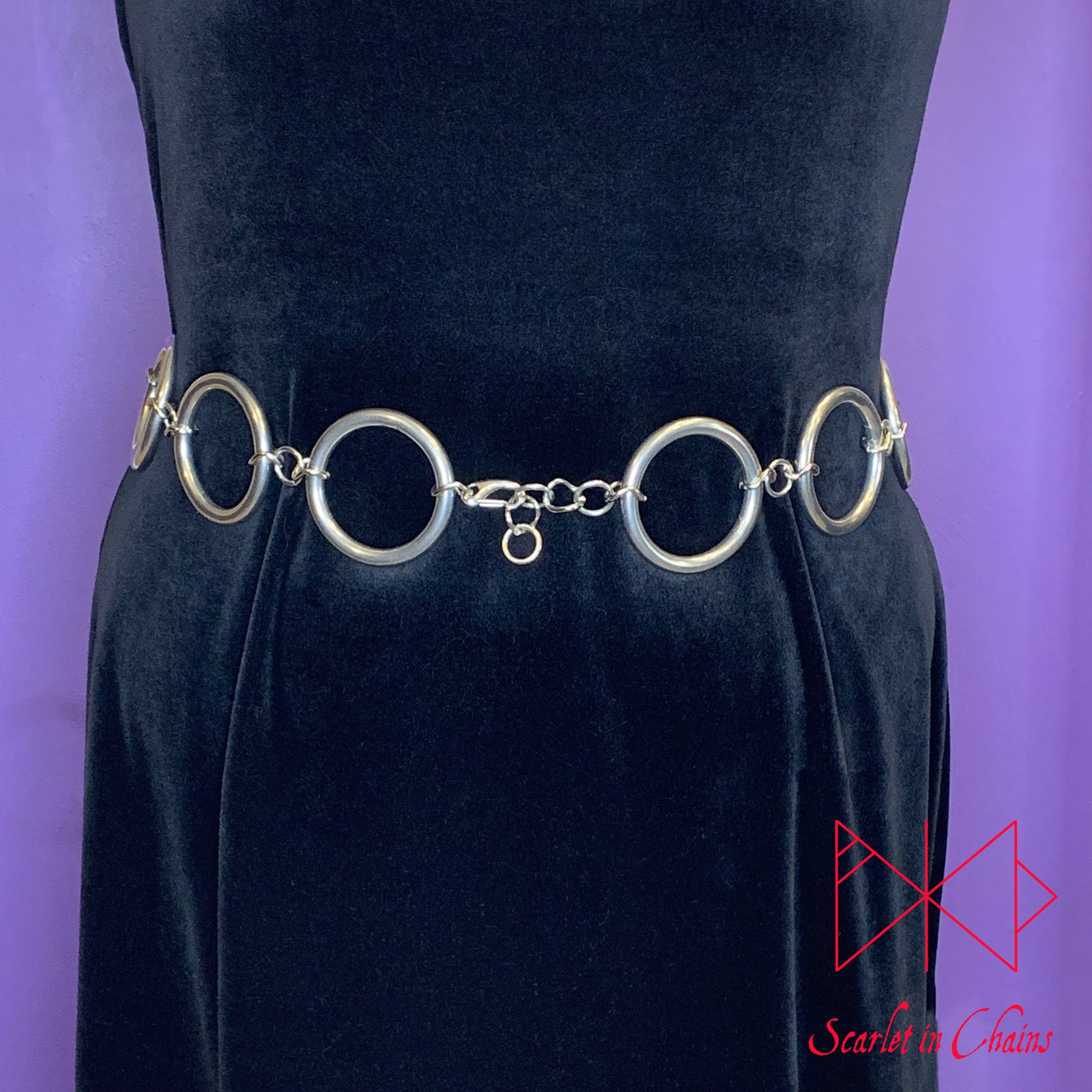 worn shot of Solar belt, large stainless steel O rings joined with large stainless steel chain links shown front
