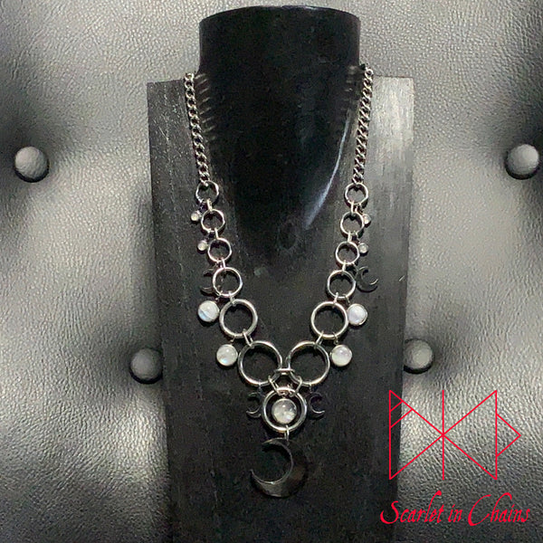 Stainless Steel Moonlight Necklace - Statement Necklace - Rainbow Moonstone - O ring collar showing on stand