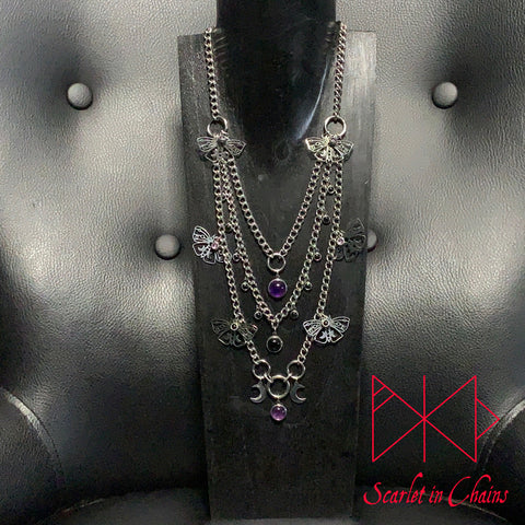 Stainless Steel Moths to a Violate Flame Necklace - Statement Necklace - Amethyst Black Onyx - O ring collar showing on stand