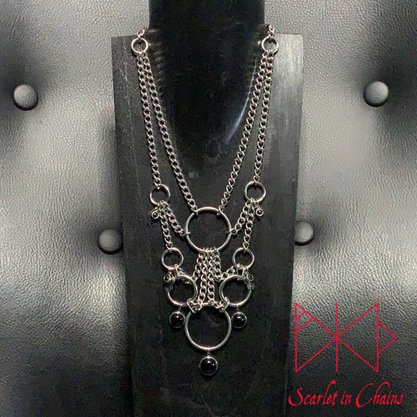 Stainless Steel Web of Eternity Necklace - Statement Necklace - Black Onyx - Spider Necklace - O ring collar showing on stand