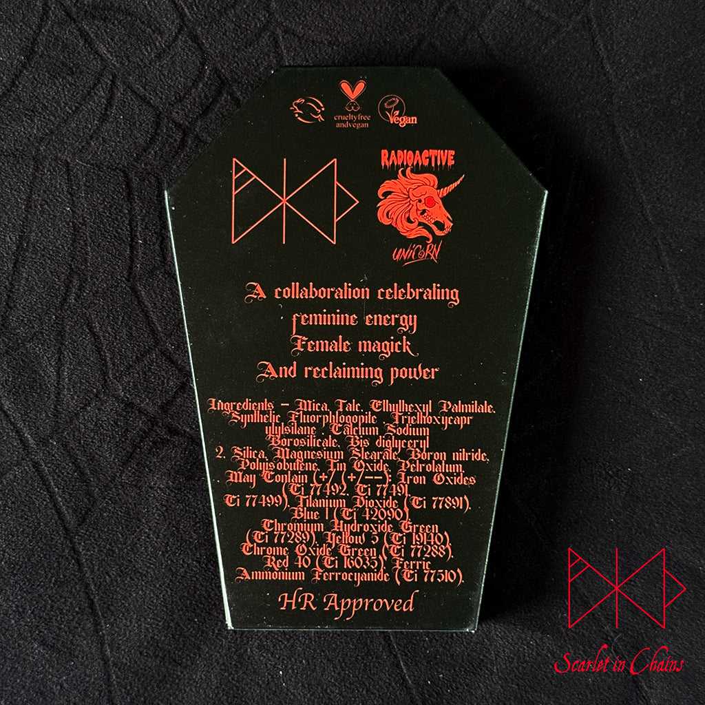 Metal Magic Mischief Makeup Pallet A Scarlet in Chains and Radioactive Unicorn Collaboration. A black coffin-shaped cover with red gothic text and symbols, featuring the words 'Ramynde' and 'unbranded' along with occult-themed lettering, photographed on a black textured fabric background.