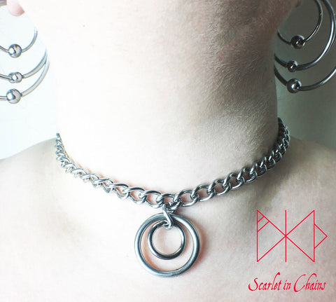 Stainless steel chain choker with a double stainless steel O ring pendant which consists of a smaller o ring inside a larger one. worn
