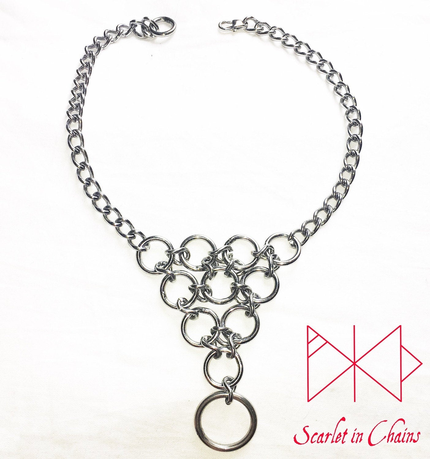 Huntress Day Collar flat Stainless steel chain choker with a triangle of o rings and a larger o ring hanging from the point of the inverted triangle of rings 