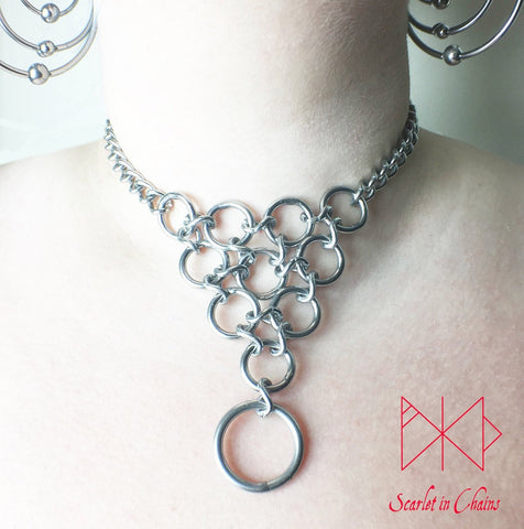 Huntress Day Collar worn Stainless steel chain choker with a triangle of o rings and a larger o ring hanging from the point of the inverted triangle of rings