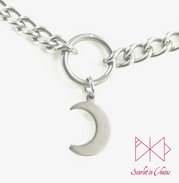 close up of stainless steel crescent moon charm on choker