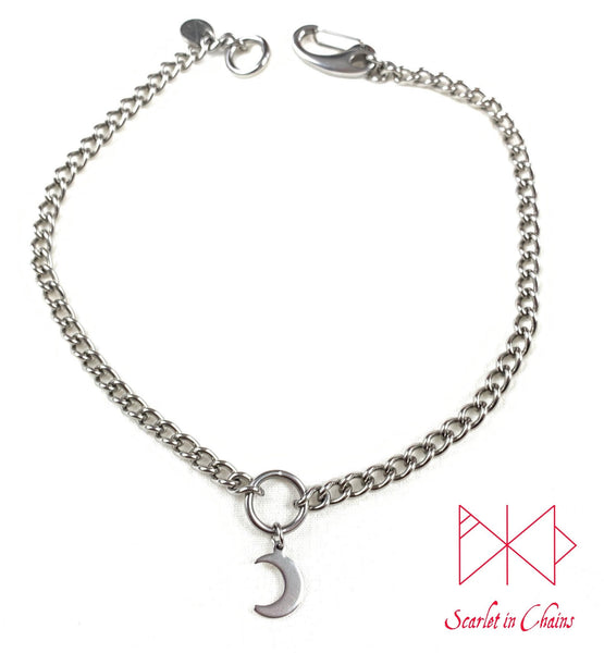 stainless steel chain O ring choker with stainless steel crescent moon charm. finished with a stainless steel clip flat shot