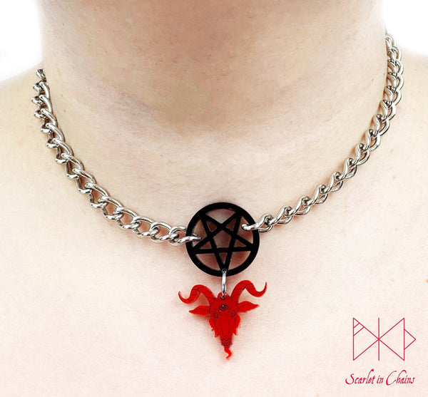 worn shot of baphomet choker, perspex baphomet and pentagram charm with a stainless steel chain choker