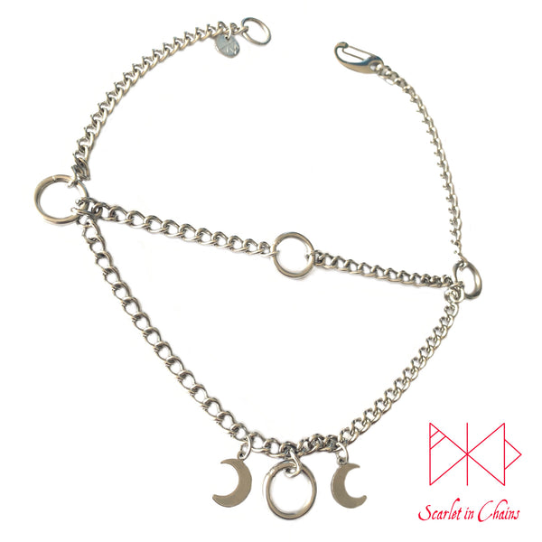Layered stainless steel chain choker necklace with o ring choker section at the top and the goddess necklace at the base shown with stainless steel clip. flat shot