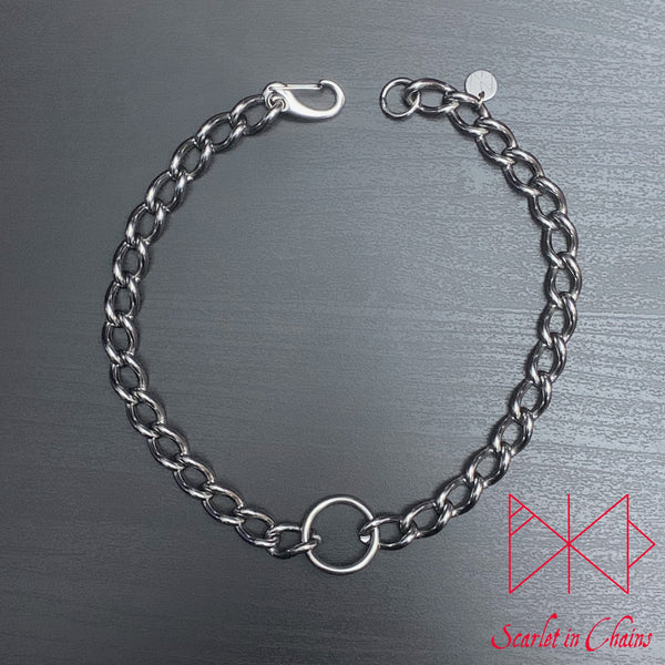 Flat view of luna collar large stainless steel chain with central o ring  finished with a stainless steel clasp